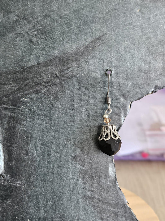 Small silver earrings and blue glass beads