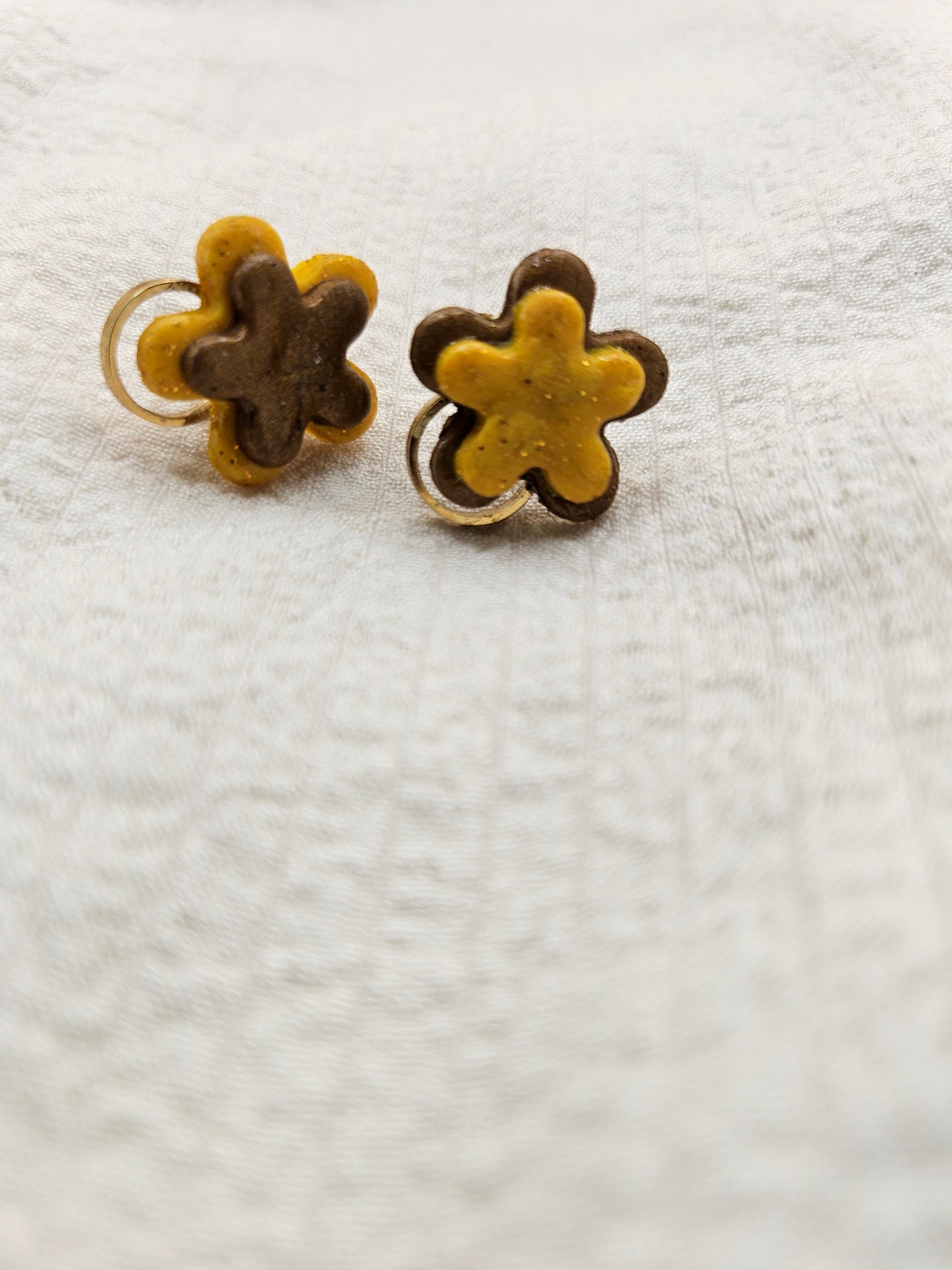 Small yellow and brown ear jewels