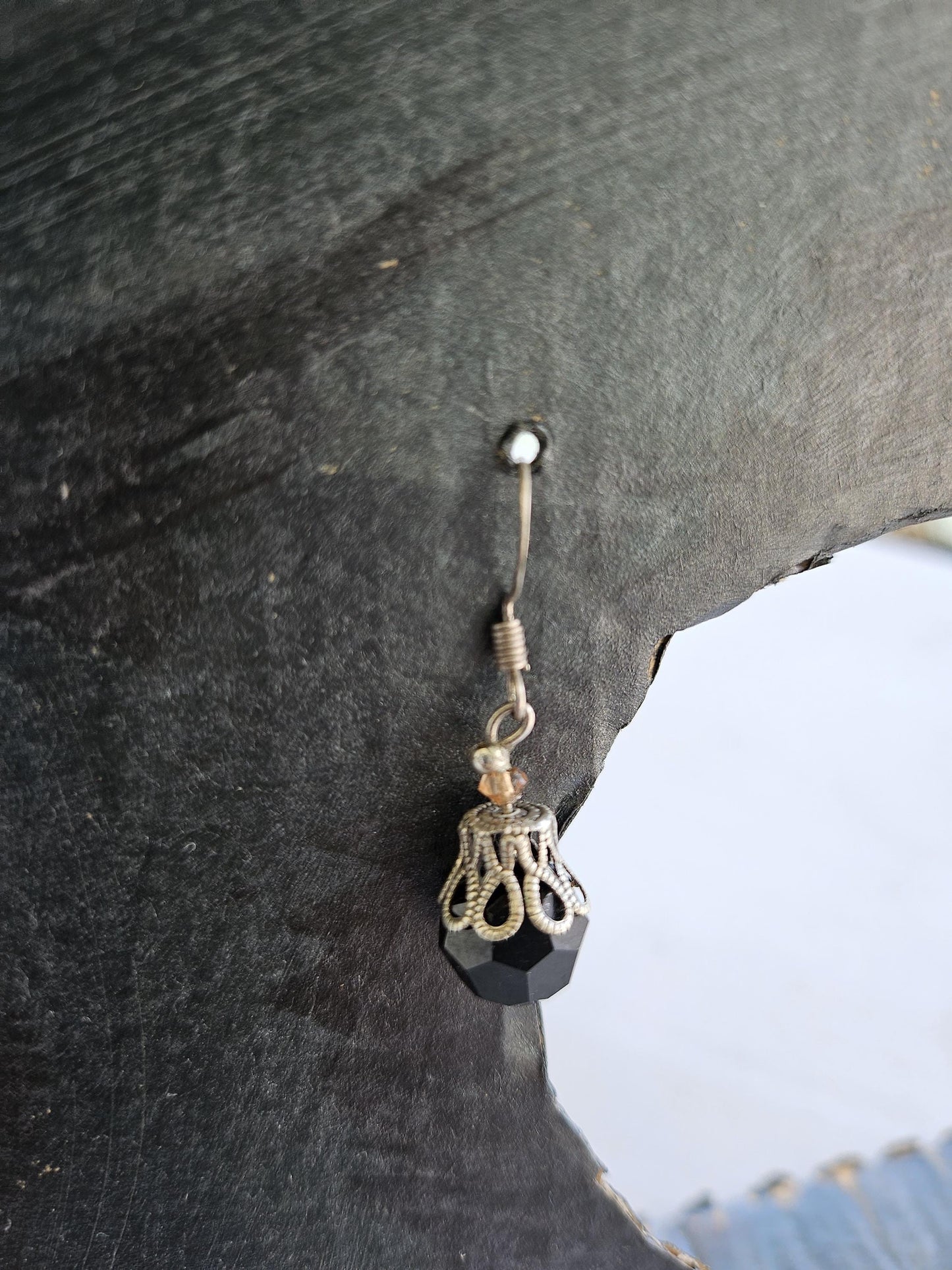 Small silver earrings and blue glass beads