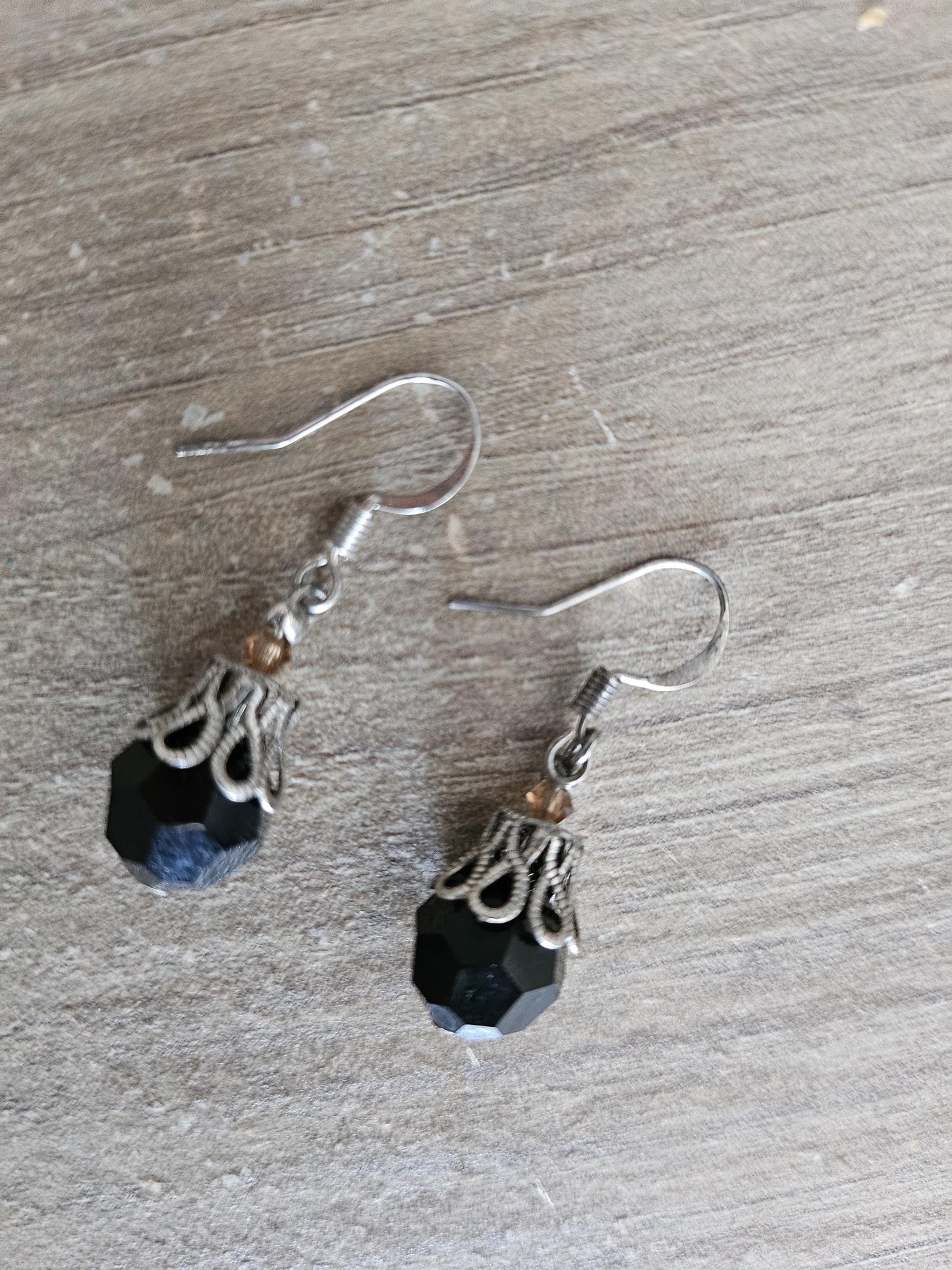 Small silver earrings and blue glass beads