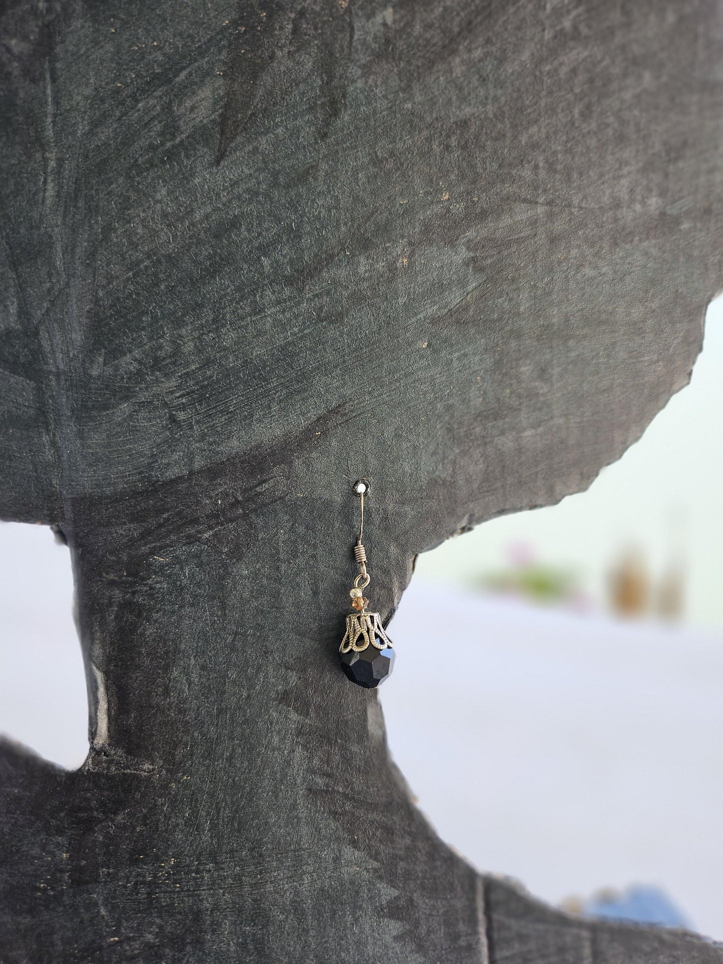 Small silver earrings and blue glass beads