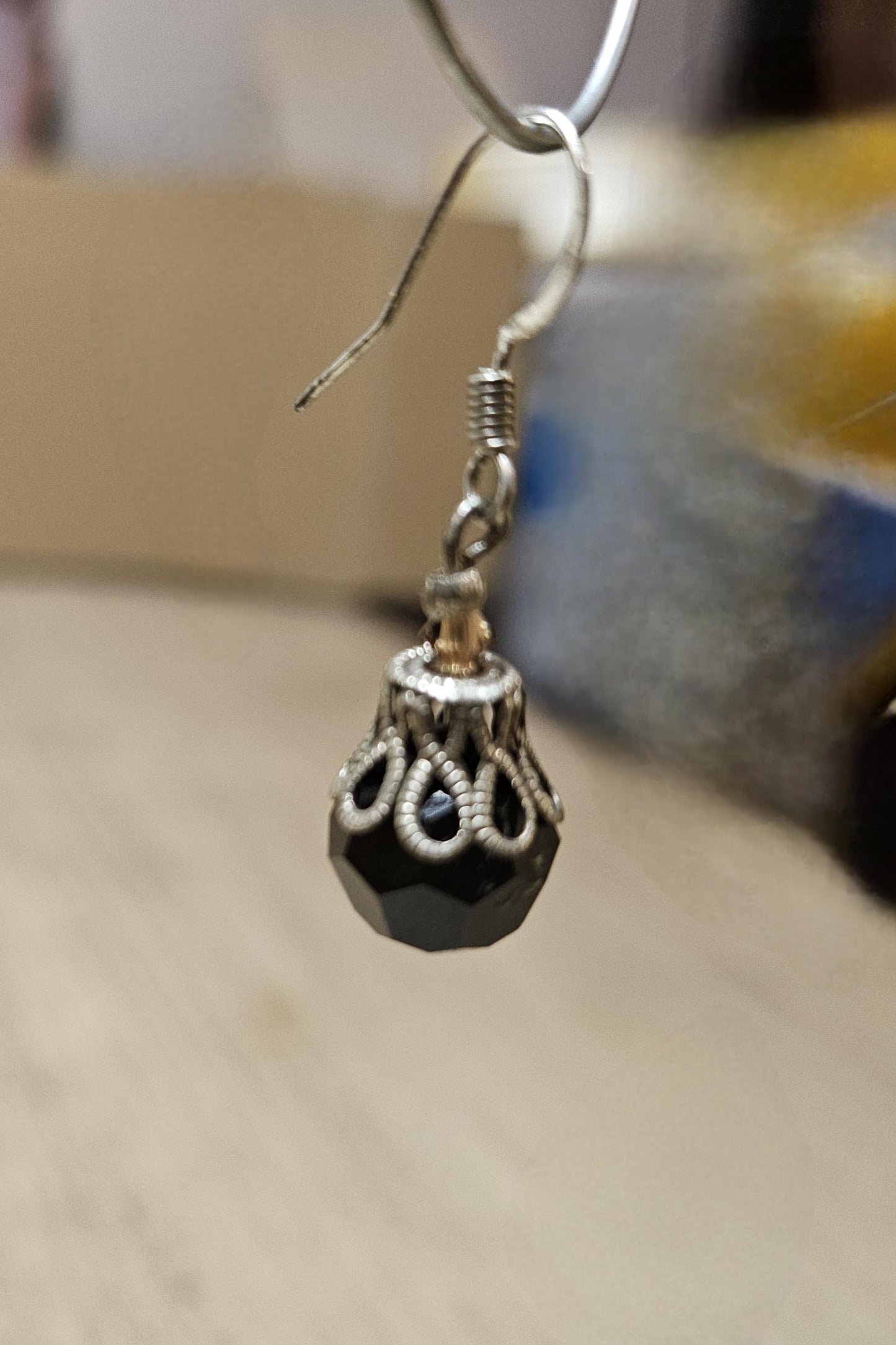 Small silver earrings and blue glass beads