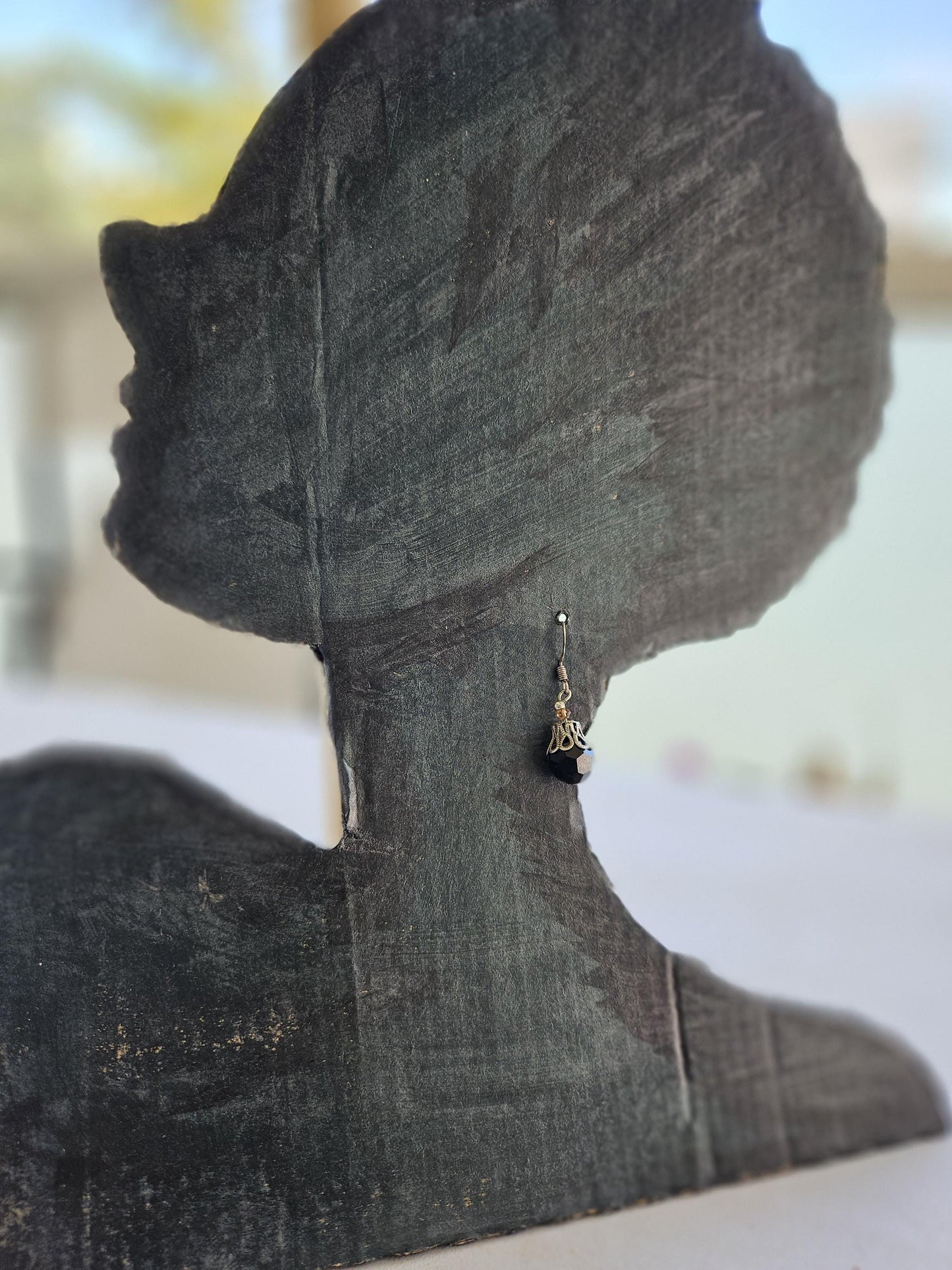 Small silver earrings and blue glass beads